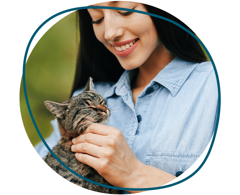 woman petting a kitten